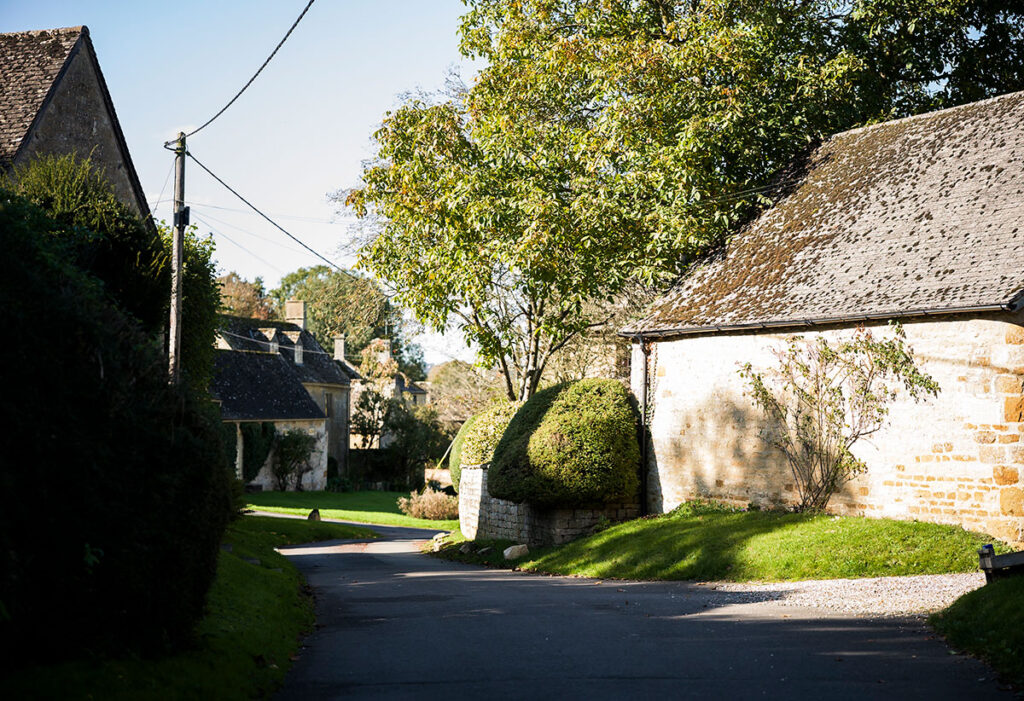 Quiet Cotswolds street and cottages. Image: Sarah Frances Kelley for The Buying Solution